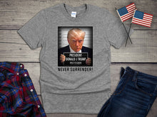 Load image into Gallery viewer, Trump Never Surrender T-shirt, Donald Trump Mugshot Tee, Free President Trump Shirt, Pro-Trump, MAGA, Inmate
